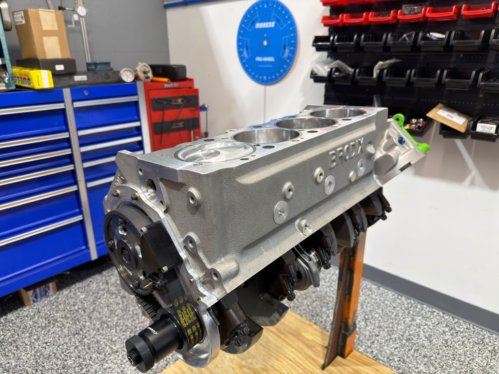 Precision machined V8 engine block on a stand in Paul Ferreira's race engine shop